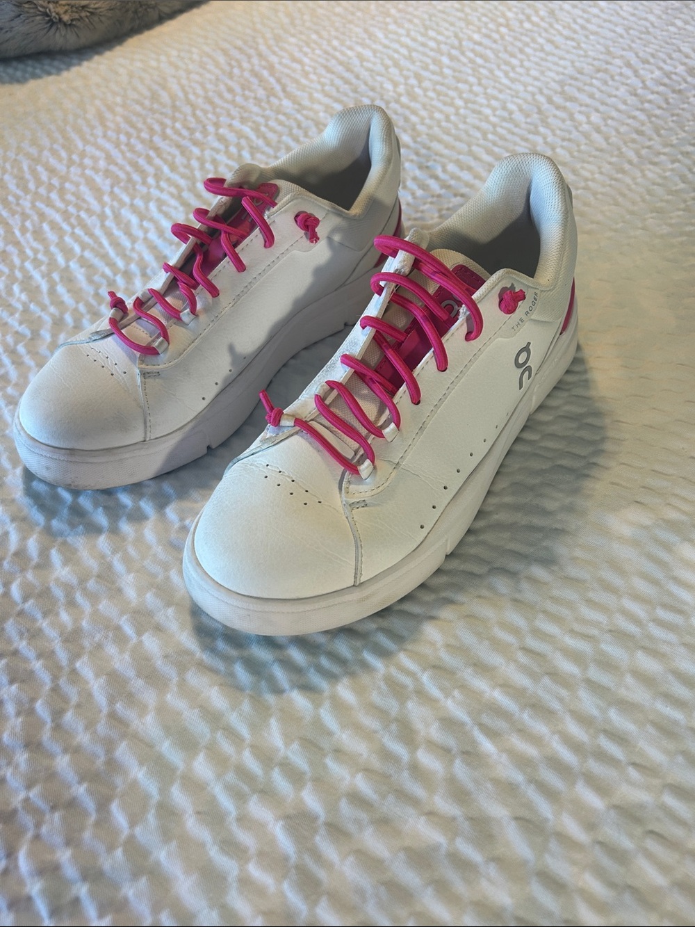 On Running women’s The Roger  White Sneakers with Hot Pink Details